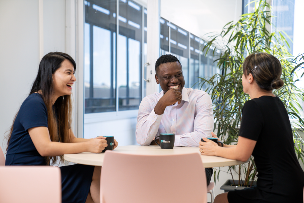 A group of diverse Nexia employees having discussion